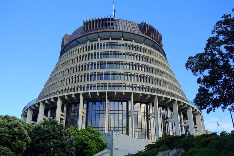 The Beehive in Wellington, seen from below against a clear sky