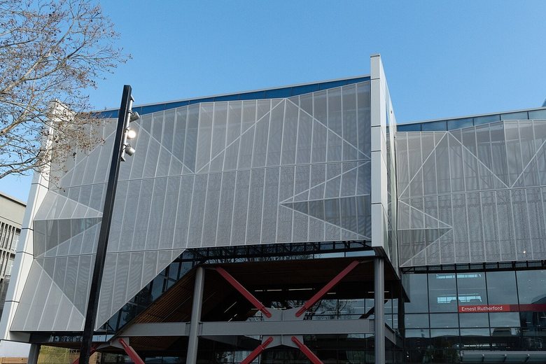 A modern university science building in Christchurch, its upper floors wrapped in folded metal screens